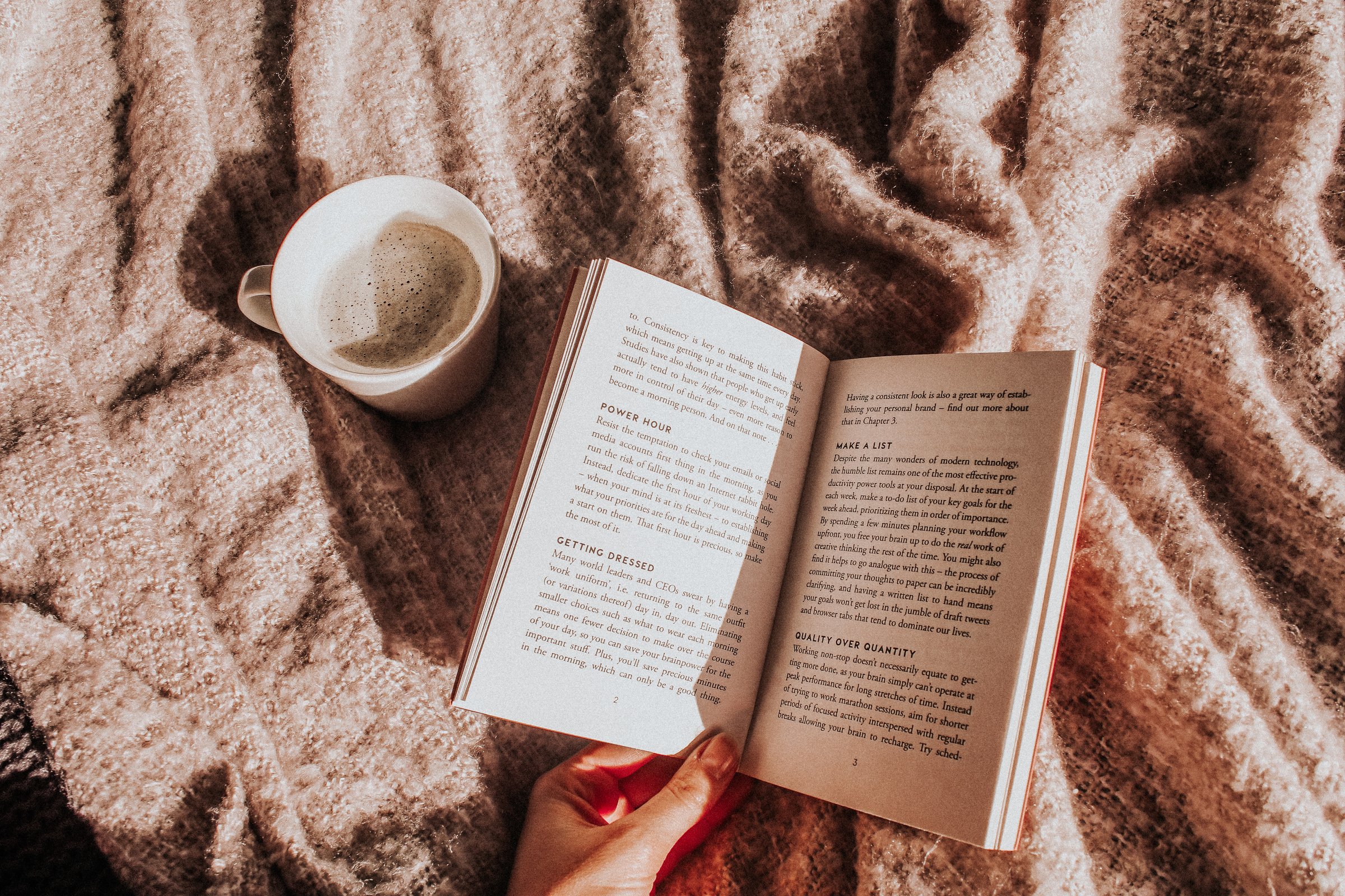 Woman Reading a Book and Drinking Coffee